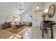 Comfortable living room featuring vaulted ceilings, a ceiling fan, and an elegant entryway at 3324 Canyon Lake Dr, Las Vegas, NV 89117