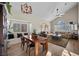 Bright living room with wood floors, vaulted ceiling, lots of natural light, and comfortable seating at 3324 Canyon Lake Dr, Las Vegas, NV 89117