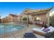 Inviting backyard patio and pool area with lounge seating at 3324 Canyon Lake Dr, Las Vegas, NV 89117