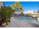 Fenced in backyard pool surrounded by desert landscaping at 3324 Canyon Lake Dr, Las Vegas, NV 89117