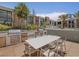 Outdoor grilling area with table and chairs for dining at 353 E Bonneville Ave # 631, Las Vegas, NV 89101