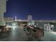 Rooftop terrace with city views, modern furniture, and dining area at 353 E Bonneville Ave # 631, Las Vegas, NV 89101