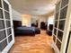 Large bedroom with wood floors and access to patio at 3580 W Moberly Ave, Las Vegas, NV 89139