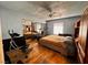 Bedroom with mirrored closet doors and hardwood floors at 3580 W Moberly Ave, Las Vegas, NV 89139