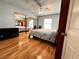 Bedroom with wood flooring and mirrored closet at 3580 W Moberly Ave, Las Vegas, NV 89139