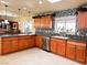 Kitchen with granite countertops and wood cabinets at 3580 W Moberly Ave, Las Vegas, NV 89139