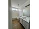 Clean bathroom with a tub, toilet, and vanity at 3710 Royal Fern Cir, Las Vegas, NV 89115