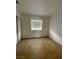 Simple bedroom with tile flooring and large window at 3710 Royal Fern Cir, Las Vegas, NV 89115