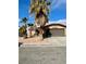 House exterior showcasing a two-car garage and desert landscaping at 3710 Royal Fern Cir, Las Vegas, NV 89115