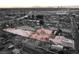 Aerial view of vacant land next to house and businesses at 3759 Glen Ave, Las Vegas, NV 89121