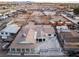 Drone image highlighting a well-maintained property with a large backyard and paved area for parking at 3759 Glen Ave, Las Vegas, NV 89121