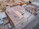 Aerial view features a house and yard including a long drive and parking surrounded by a fenced yard at 3759 Glen Ave, Las Vegas, NV 89121