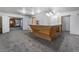 Home bar with wood counter and grey carpet at 3759 Glen Ave, Las Vegas, NV 89121