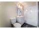 Bathroom offers a modern vanity and mirror, white tiles and an inset bathtub at 3759 Glen Ave, Las Vegas, NV 89121