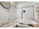 Well-lit bathroom with large soaking tub and patterned tile flooring at 3759 Glen Ave, Las Vegas, NV 89121