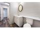 View of bathroom with toilet and sink with white cabinets and oval mirror on wall at 3759 Glen Ave, Las Vegas, NV 89121