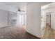 Bedroom with ceiling fan, doorway to bathroom, and window for natural light at 3759 Glen Ave, Las Vegas, NV 89121