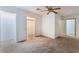 Neutral bedroom with ceiling fan and doors leading to other rooms at 3759 Glen Ave, Las Vegas, NV 89121