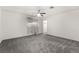 Bright bedroom featuring ceiling fan and grey carpet at 3759 Glen Ave, Las Vegas, NV 89121