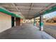 Covered patio with concrete flooring and teal accented columns at 3759 Glen Ave, Las Vegas, NV 89121