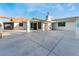 Wide view of exterior of property with turquoise trim and large concrete parking pad at 3759 Glen Ave, Las Vegas, NV 89121