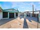 Wide view of exterior of property with turquoise trim and large concrete parking pad at 3759 Glen Ave, Las Vegas, NV 89121