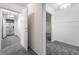 Hallway with gray carpet, white walls and multiple doorways for easy access at 3759 Glen Ave, Las Vegas, NV 89121