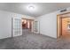 Bright living room with grey carpet, chandelier, and views into adjacent rooms at 3759 Glen Ave, Las Vegas, NV 89121