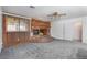 Living room with brick fireplace and grey carpet at 3759 Glen Ave, Las Vegas, NV 89121