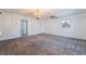 A spacious living room with an ornate chandelier and window bars at 3759 Glen Ave, Las Vegas, NV 89121