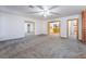 A well lit living room shows hardwood trim, and neutral colored carpets at 3759 Glen Ave, Las Vegas, NV 89121