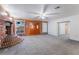 Living room with brick fireplace and grey carpet at 3759 Glen Ave, Las Vegas, NV 89121