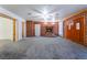 Living room with brick fireplace and grey carpet at 3759 Glen Ave, Las Vegas, NV 89121