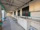 View of the outdoor kitchen area featuring a double sink and storage cabinets beneath the countertop at 3759 Glen Ave, Las Vegas, NV 89121