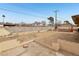 Large backyard with open space and block retaining walls at 3766 Millwood Ave, Las Vegas, NV 89121