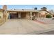 Front view of a ranch style home with carport and gravel landscaping at 3766 Millwood Ave, Las Vegas, NV 89121