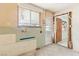 Unfinished laundry area with window and doorway at 3766 Millwood Ave, Las Vegas, NV 89121