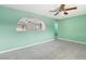 Living room with an archway opening to another room and a ceiling fan at 3766 Millwood Ave, Las Vegas, NV 89121