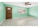 Spacious living room with light green walls and tiled floor at 3766 Millwood Ave, Las Vegas, NV 89121