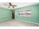 Living room featuring light green walls, tiled floors, and ceiling fan at 3766 Millwood Ave, Las Vegas, NV 89121