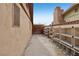 Side yard with storage shelving and access gate at 3766 Millwood Ave, Las Vegas, NV 89121