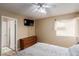 Bright bedroom showcasing a ceiling fan and a view of the attached bathroom at 3800 Desert Marina Dr # 158, Laughlin, NV 89029