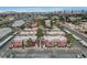 Aerial view of a community of Spanish-style homes with a pool and ample parking at 4050 Pacific Harbors Dr # 201, Las Vegas, NV 89121