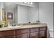 Bathroom with granite vanity and large mirror at 4050 Pacific Harbors Dr # 201, Las Vegas, NV 89121