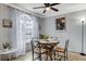 Cozy dining area with table and chairs near a large window at 4050 Pacific Harbors Dr # 201, Las Vegas, NV 89121