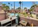 Private patio overlooking the community pool and landscaping at 4050 Pacific Harbors Dr # 201, Las Vegas, NV 89121