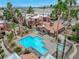 Aerial view of community pool and spa, surrounded by lush landscaping and residential buildings at 4050 Pacific Harbors Dr # 201, Las Vegas, NV 89121