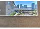 Balcony view overlooking a community spa and city skyline at 4200 S Valley View Blvd # 2081, Las Vegas, NV 89103