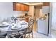 Kitchen with granite counters, dining area, and laundry in unit at 4200 S Valley View Blvd # 2081, Las Vegas, NV 89103