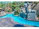 Inviting kidney shaped pool with a large rock waterfall feature at 4200 S Valley View Blvd # 2081, Las Vegas, NV 89103